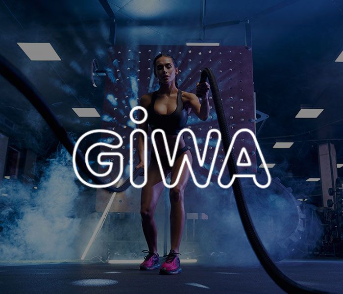 Logo di GIWA Srl con in sottofondo una ragazza che si allena in palestra
